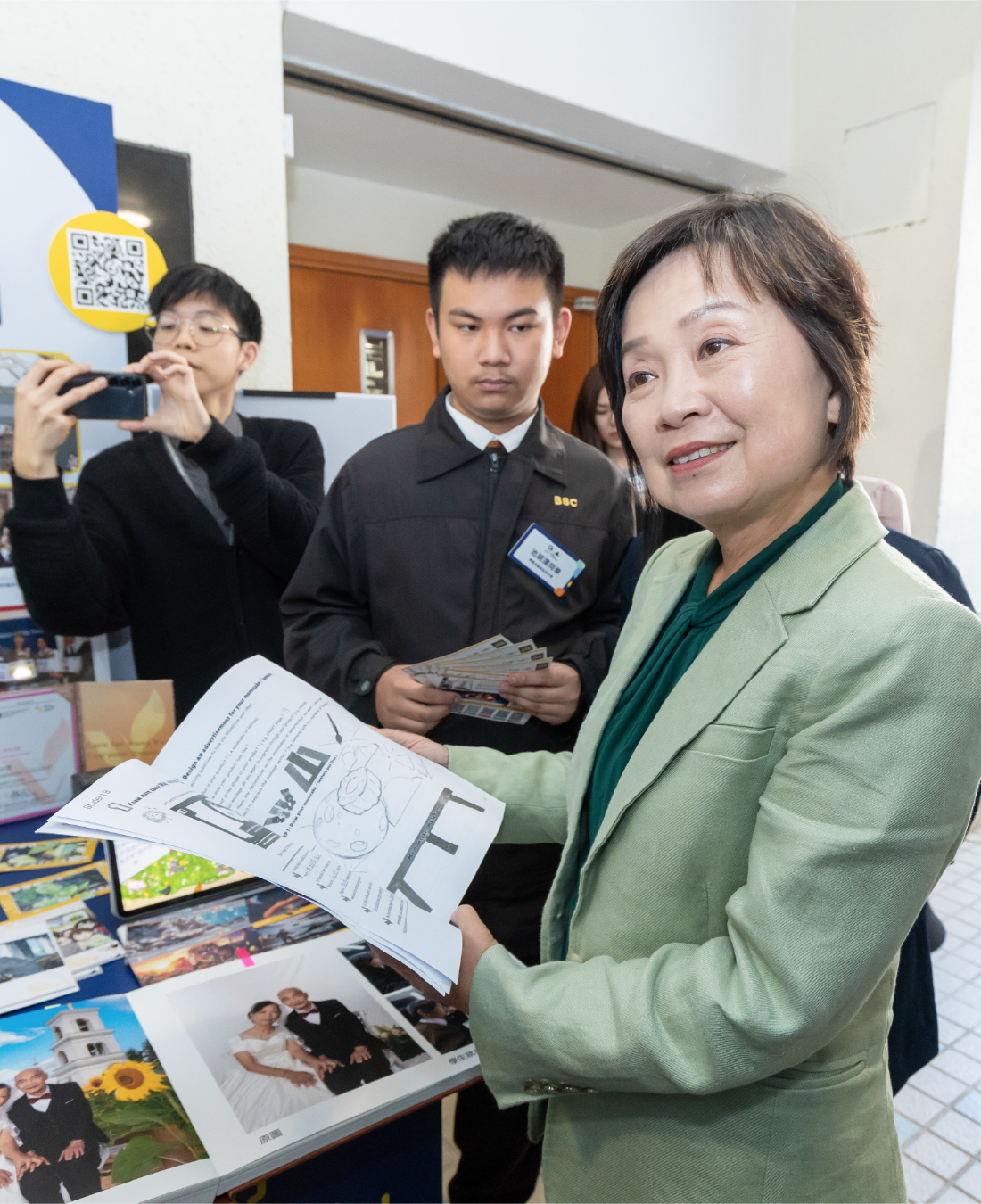 Dr Choi engages with secondary school students as they share their AI learning and JC GoAI project in March 2026.