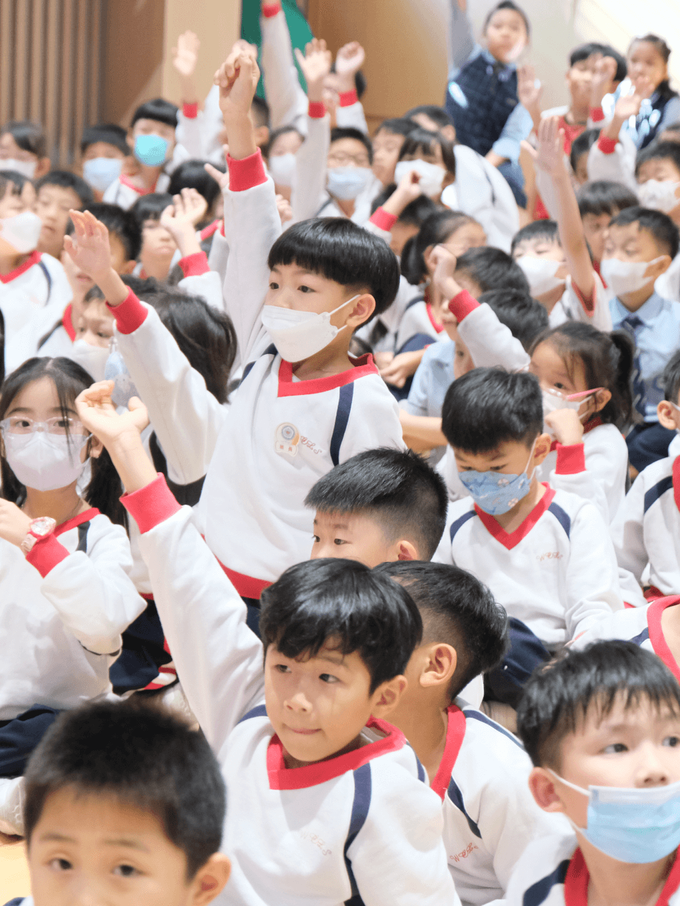 a connect kids raising hands