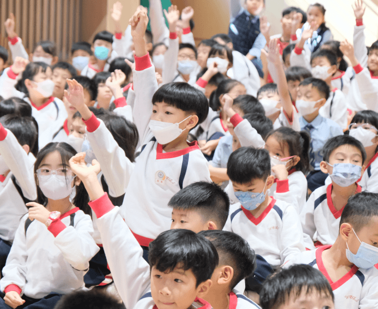 a connect kids raising hands