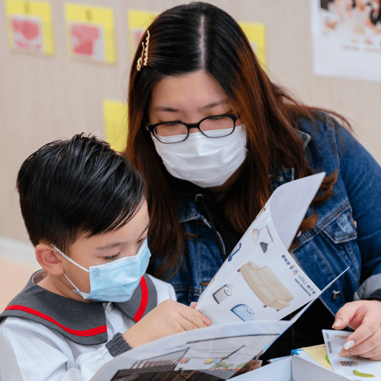 june tang reading book with kid