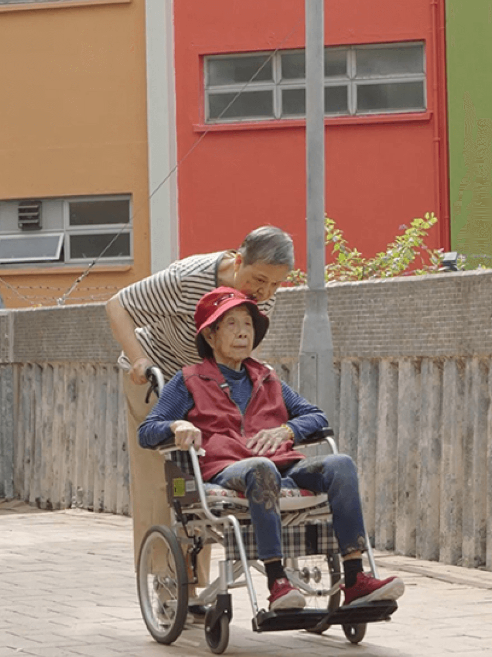 caring and being cared carer pushing wheelchair