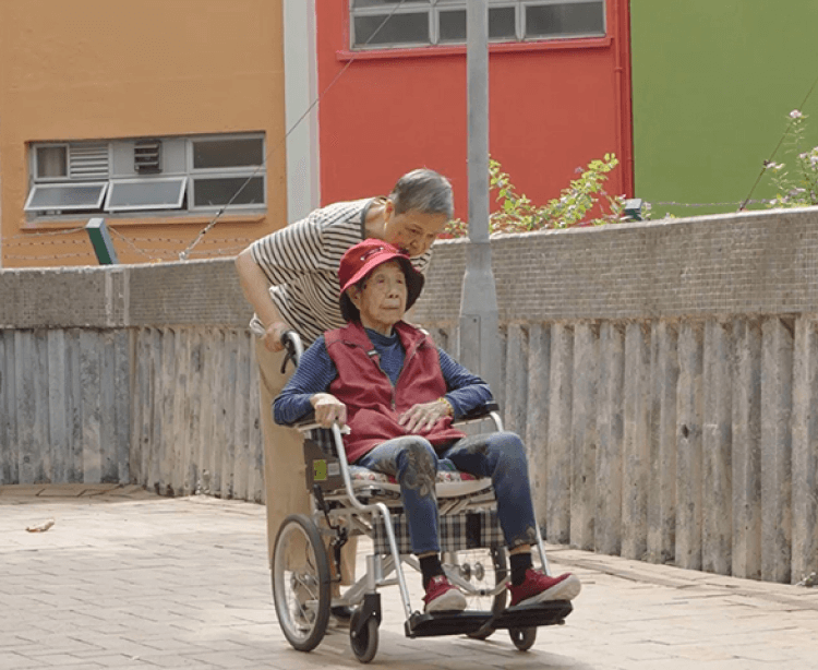caring and being cared carer pushing wheelchair