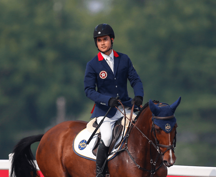 thomas ho in competition riding horse portrait image