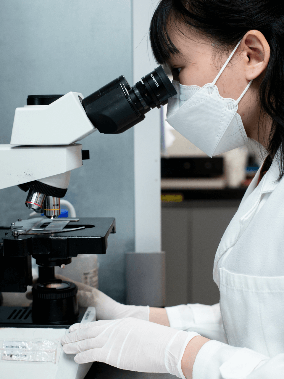 monica chan Using a microscope portrait image