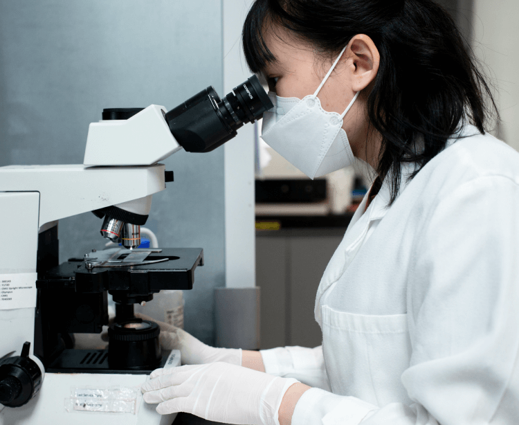 monica chan Using a microscope portrait image