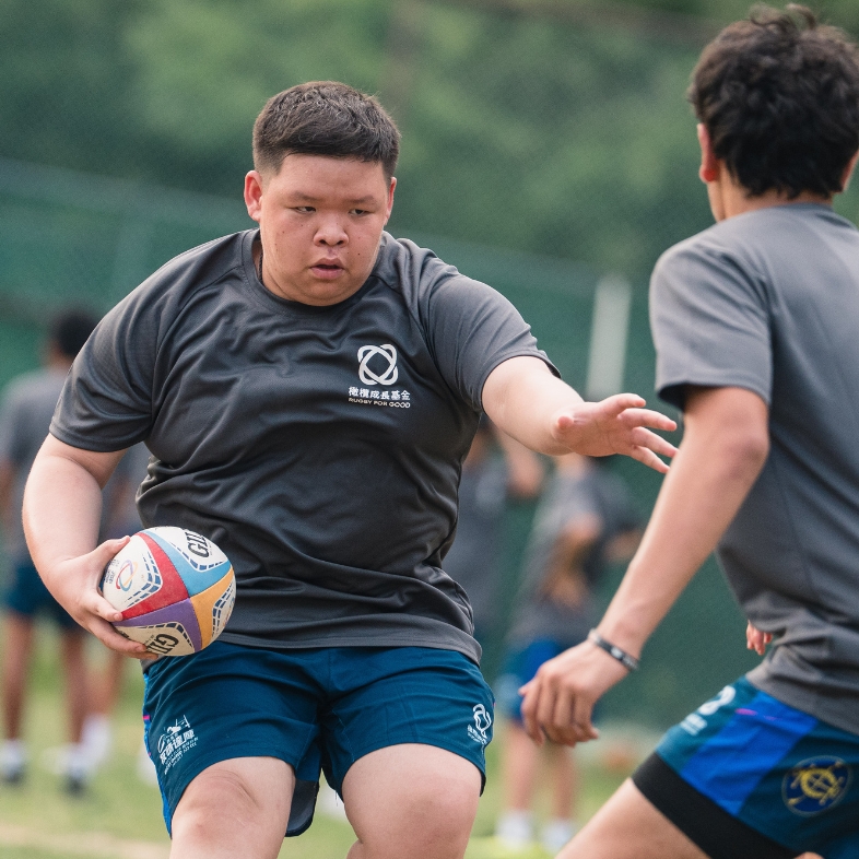 Passing the ball together on the pitch, and breaking through barriers in life